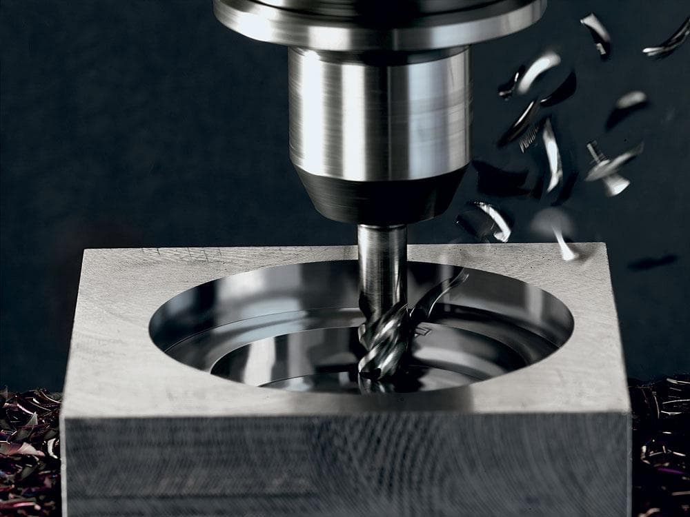 CNC spindle cutting a precision metal cavity